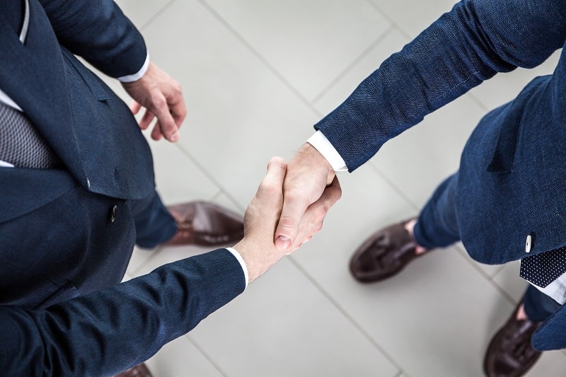 Business people shaking hands, finishing up a meeting