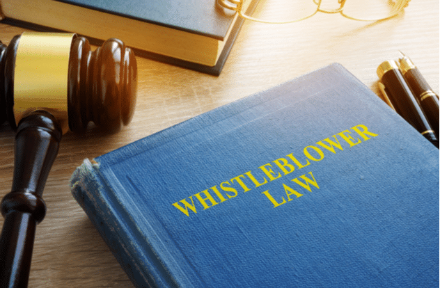 Whistleblower law on a court desk.