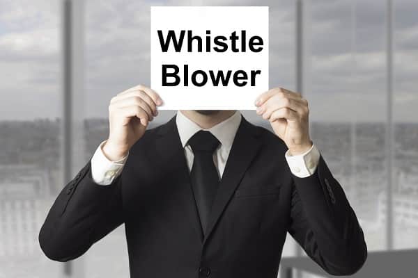 man with whistleblower sign