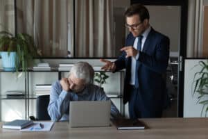Boss angry at his employee who blew the whistle on illegal activity.